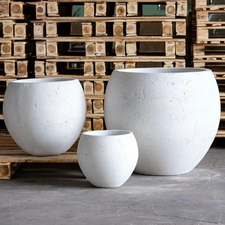 Set of three Jobu Home Sphere Planters in varying sizes for stylish indoor or outdoor plants