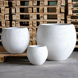 Set of three white Sphere Planters in varying sizes for showcasing indoor plants