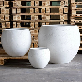Set of three white Sphere Planters in varying sizes for showcasing indoor plants