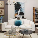 Orsina Square Cushion in soft blue and white, adding a pop of colour to a modern living room setup