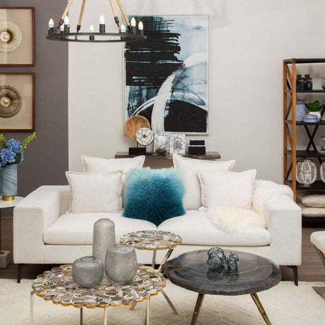 Orsina Square Cushion in soft blue and white, adding a pop of colour to a modern living room setup