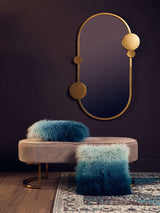 Orsina Square Cushion in teal and blue with soft faux fur on a stylish bench