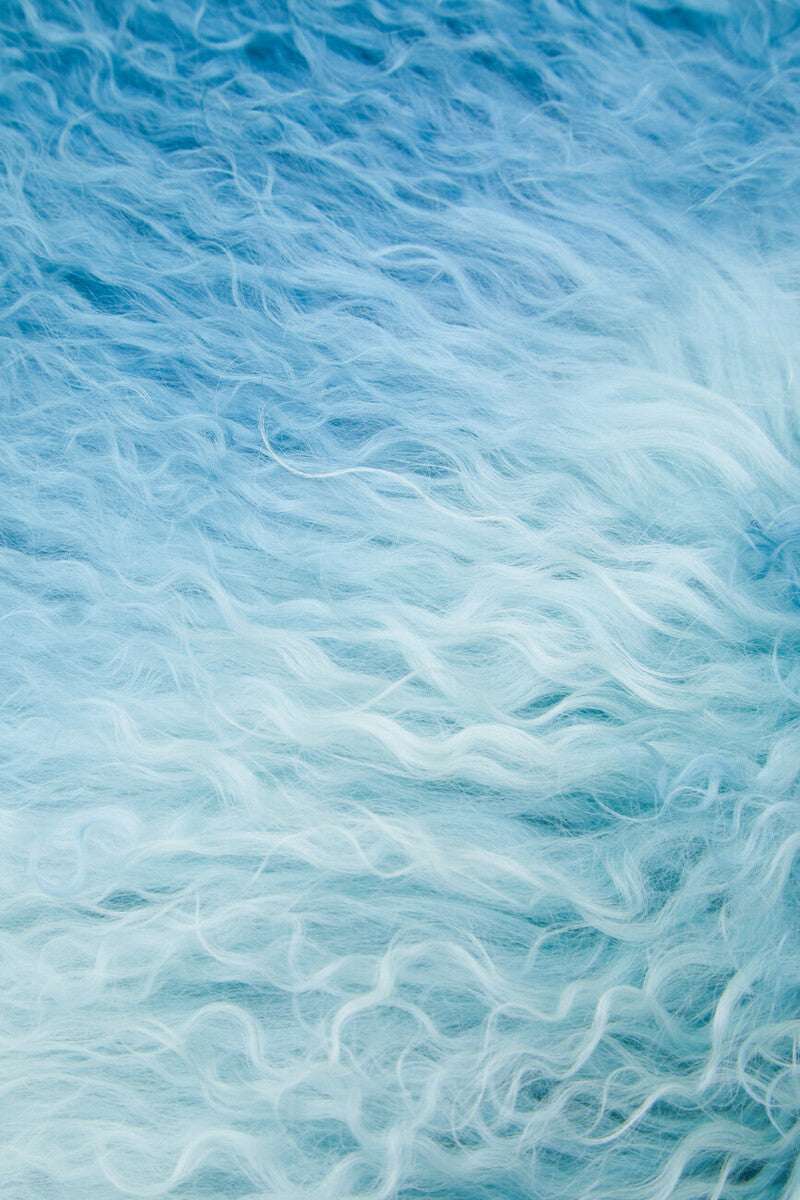 Soft Blue Square Cushion with a Textured Surface for Stylish Home Decor