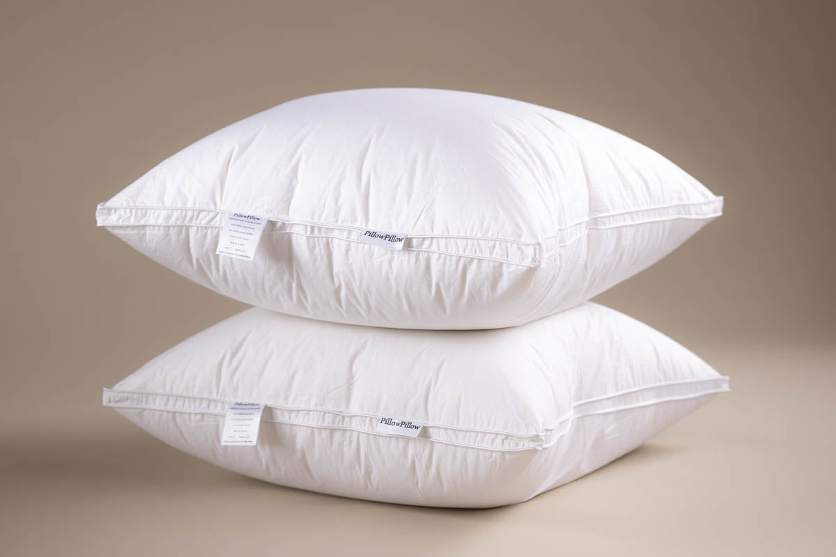 Two fluffy white Square Pillows from PillowPillow for comfortable sleeping and support