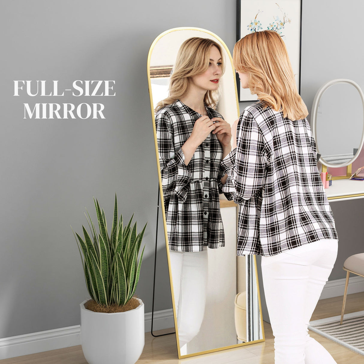 Wise Galleria Standing Mirror in modern design, reflecting a woman in stylish attire