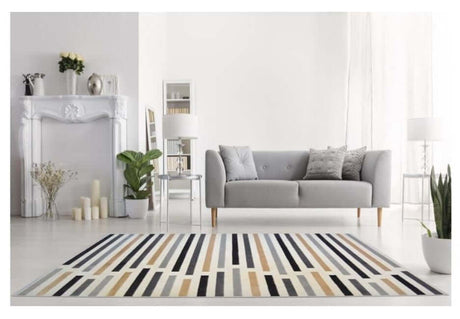 Stylish Stripe Rug in neutral tones enhancing a modern living room decor with grey sofa and plants