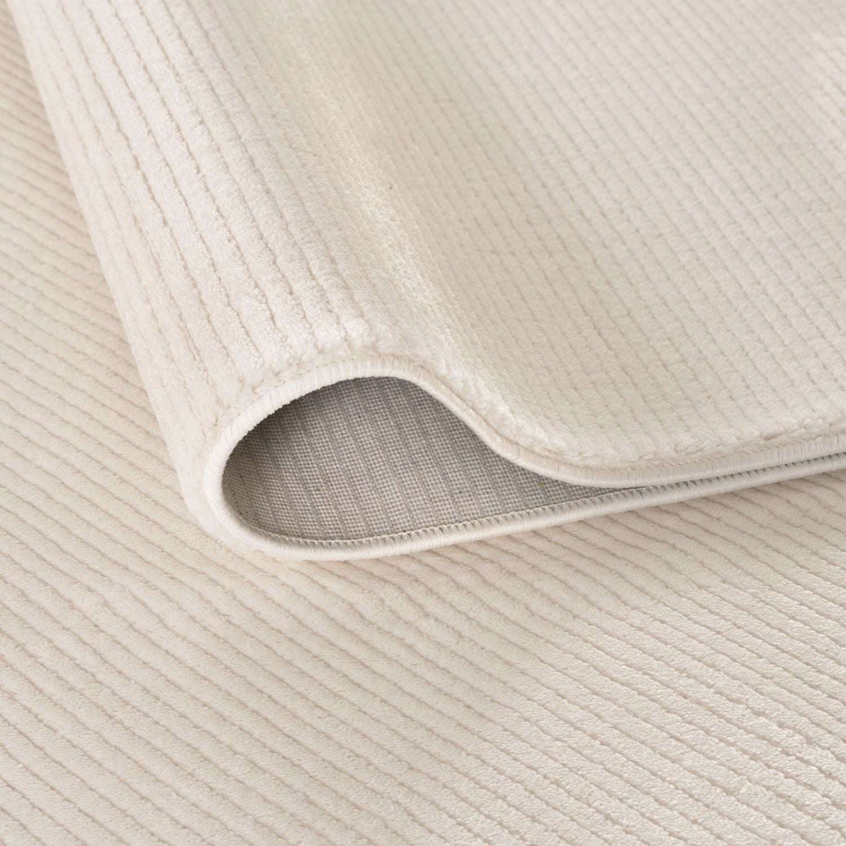 Soft beige Striped Rug with a textured surface, perfect for adding warmth to any room
