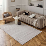 Neutral Striped Rug placed elegantly under a stylish sofa in a modern living room