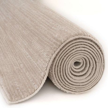 Textured beige Striped Rug rolled up, perfect for adding warmth to any room