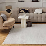 Modern living room featuring a soft Striped Rug beneath a stylish coffee table and plush sofa