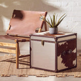 Orsina Striped Rug under a chair and storage box, adding warmth to the modern decor