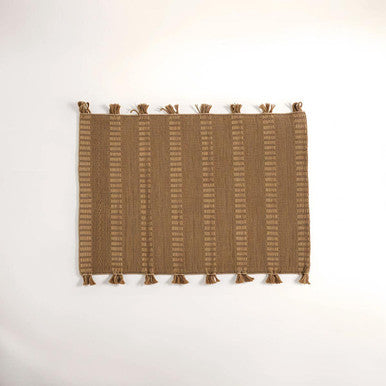 Orsina Striped Rug in warm brown tones with decorative tassels for stylish home decor