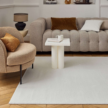 Stylish Striped Rug in a light colour complementing a modern living room with plush furniture