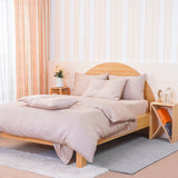 SHEET STORY Fitted Sheet in soft beige colour on a modern wooden bed with cushions
