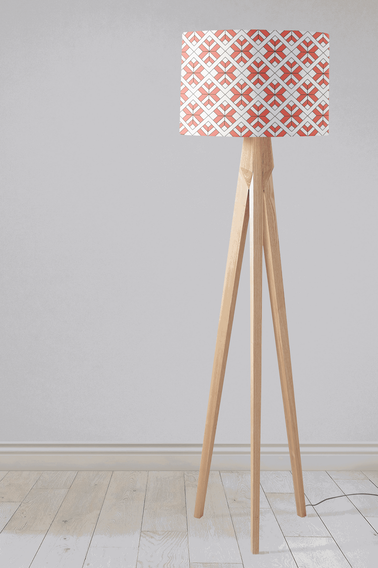 Shadow Bright Lampshade with a geometric design on a modern tripod floor lamp