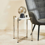 Orsina Side Table with a Marble Top and Modern Metal Frame beside a Stylish Armchair