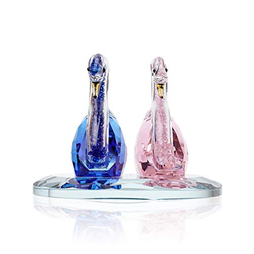 Elegant glass Swan figurines in blue and pink, perfect as decorative accents for any home