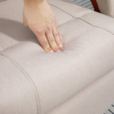 Close-up of a hand pressing the soft upholstery of a Wise Galleria swivel chair in neutral colour