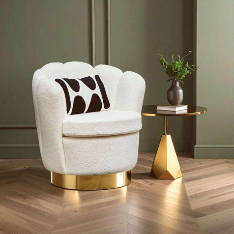 Orsina Swivel Chair in Cream with Black Accent Cushion and Gold Base next to a Stylish Side Table
