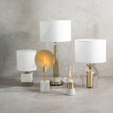 Orsina Table Lamp collection featuring various designs and finishes in elegant materials