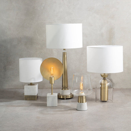 Orsina Table Lamp collection featuring various designs and finishes in elegant materials