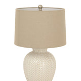 Decorative ceramic table lamp with a woven design and a neutral fabric shade