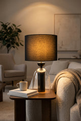 Orsina Table Lamp with a clear base and black fabric shade for modern home decor