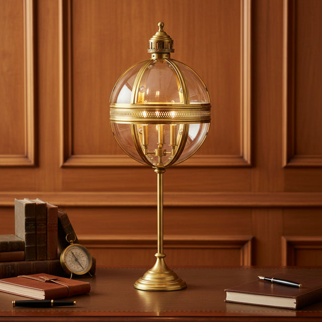 Orsina Table Lamp with a vintage brass design and glass globe, perfect for home or office decor
