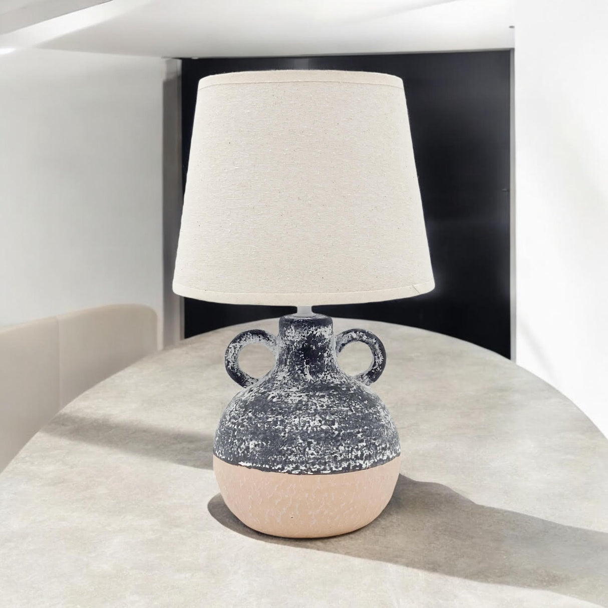 MSL Table Lamp with a textured ceramic base and a neutral fabric shade for modern decor