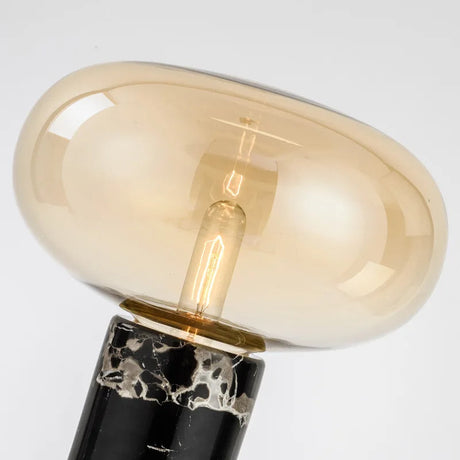 Stylish Nisu Home Table Lamp with a sleek black base and elegant amber glass shade