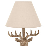 Unique deer head table lamp with a natural fabric shade for rustic home decor