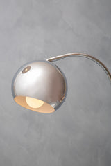 Orsina Table Lamp with a sleek silver dome shade and elegant curved design for modern decor