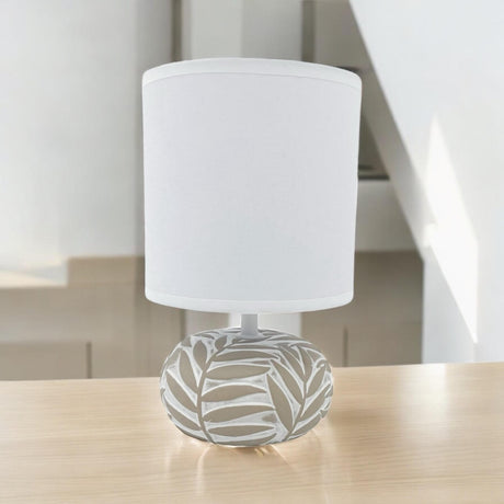 MSL Table Lamp with a decorative leaf-patterned base and white shade for stylish home lighting