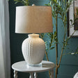 Ceramic Table Lamp with a textured base and a natural fabric shade, ideal for modern home decor