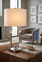 Elegant Orsina Table Lamp with a stylish design, featuring a white shade and polished metal base