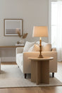 Orsina Table Lamp with beige lampshade on a modern side table in a cozy living room
