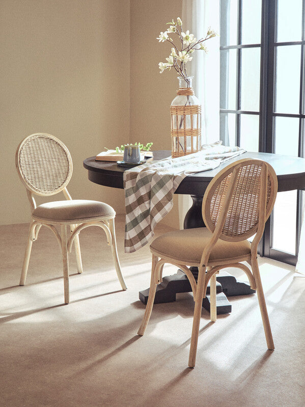 Stylish Orsina tablecloth draped over a table in a modern dining room setting