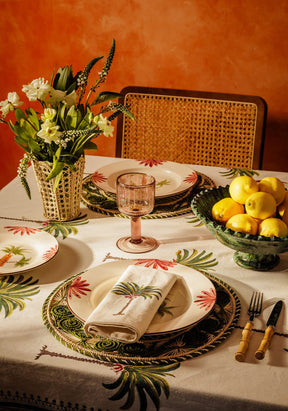 Casa by Josephine Jenno Tablecloth featuring a tropical palm leaf design, perfect for elegant dining
