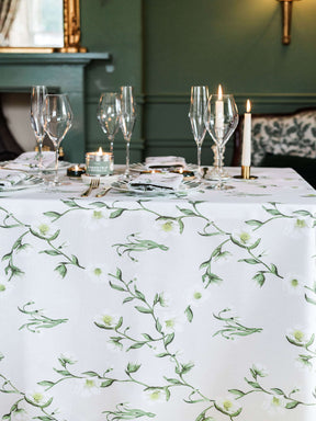Avalon Home UK Floral Tablecloth on Elegant Dining Table with Glassware and Candles