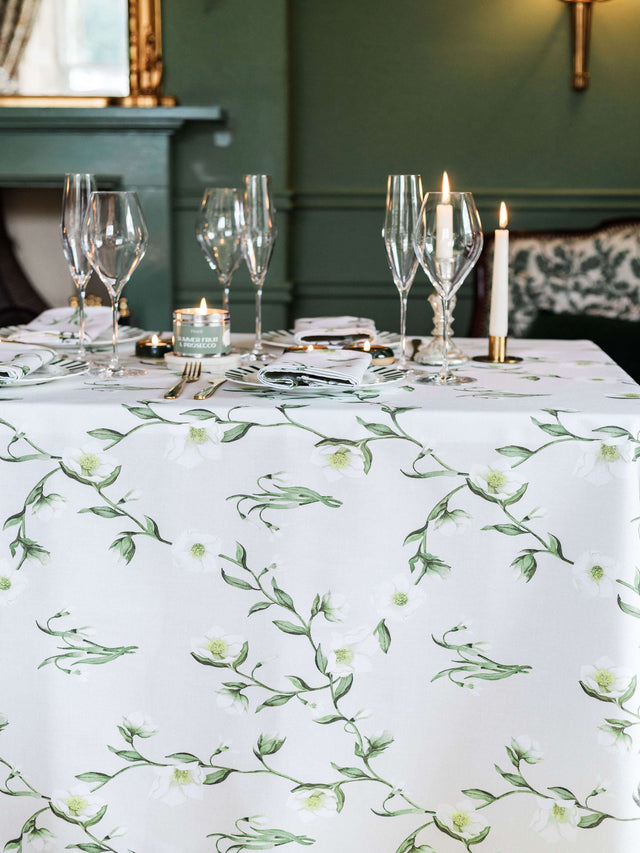 Avalon Home UK Floral Tablecloth on Elegant Dining Table with Glassware and Candles