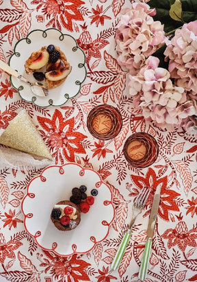 Casa by Josephine Jenno floral tablecloth featuring red and white patterns with elegant table settings