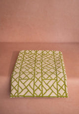 Casa by Josephine Jenno decorative tablecloth with a green geometric pattern on a neutral background