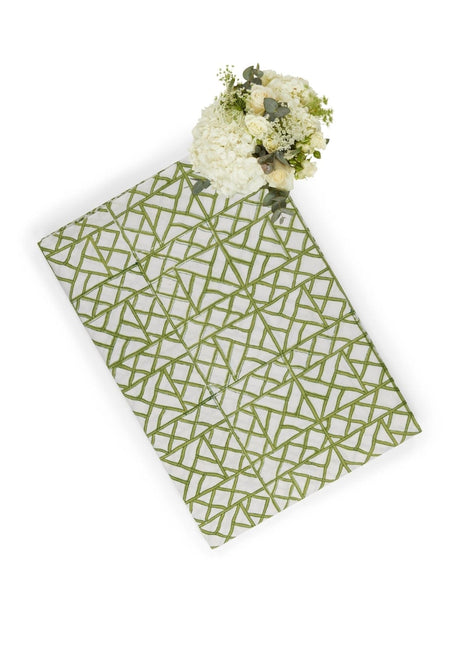 Casa by Josephine Jenno tablecloth with a geometric green pattern, perfect for elegant dining settings