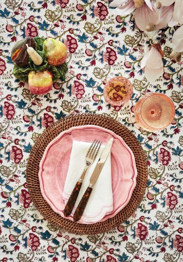 Casa by Josephine Jenno floral tablecloth with pink plates and cutlery set for elegant dining