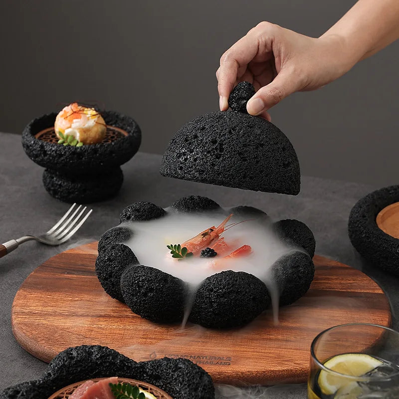 Unique Nisu Home black tableware set featuring stylish serving dishes and a wooden platter