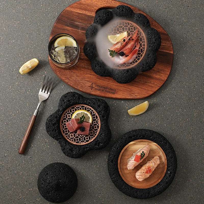 Stylish Nisu Home tableware set featuring elegant black stone dishes and wooden serving board