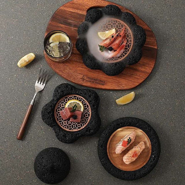 Stylish Nisu Home tableware set featuring elegant black stone dishes and wooden serving board