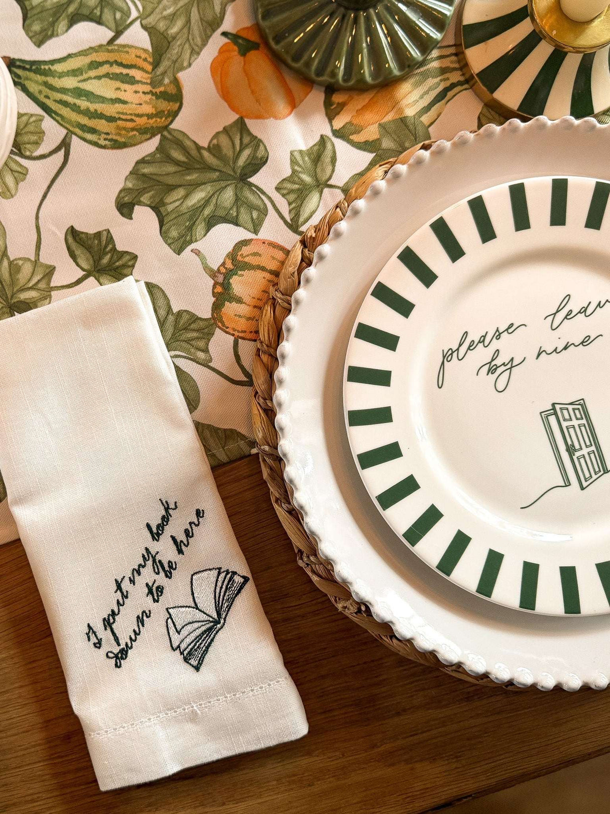 Stylish Bone China Plate with Green Stripes on a Table Setting with Decorative Linen Napkin