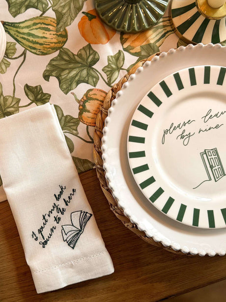 Stylish Bone China Plate with Green Stripes on a Table Setting with Decorative Linen Napkin
