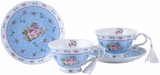 Delicate blue floral porcelain teacups and saucers perfect for displaying on a cake stand